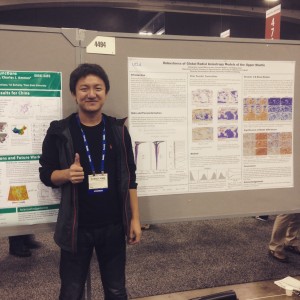 Zheng Xing in front of his poster